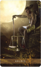 Tarot card featuring Anubis with scales and moon in background