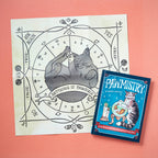 Cat-themed book and poster on a pink background