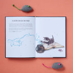 Open book with illustrations of a cat and mouse on a pink background