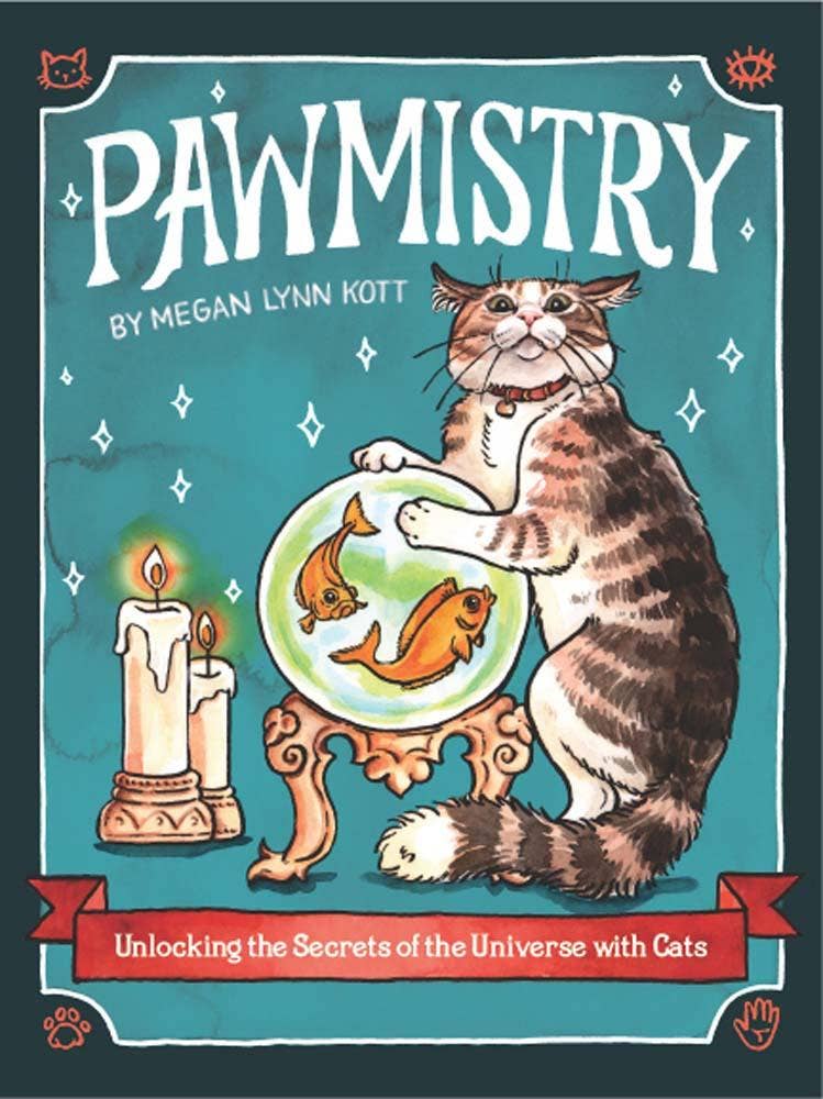 Book cover of 'Pawmistry' featuring a cat with a crystal ball and candles on a teal background.