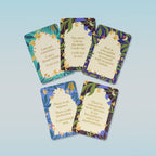 Four cards with motivational phrases on a light blue background