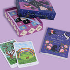 The Little Witch's Oracle Deck with cards and box on a purple background