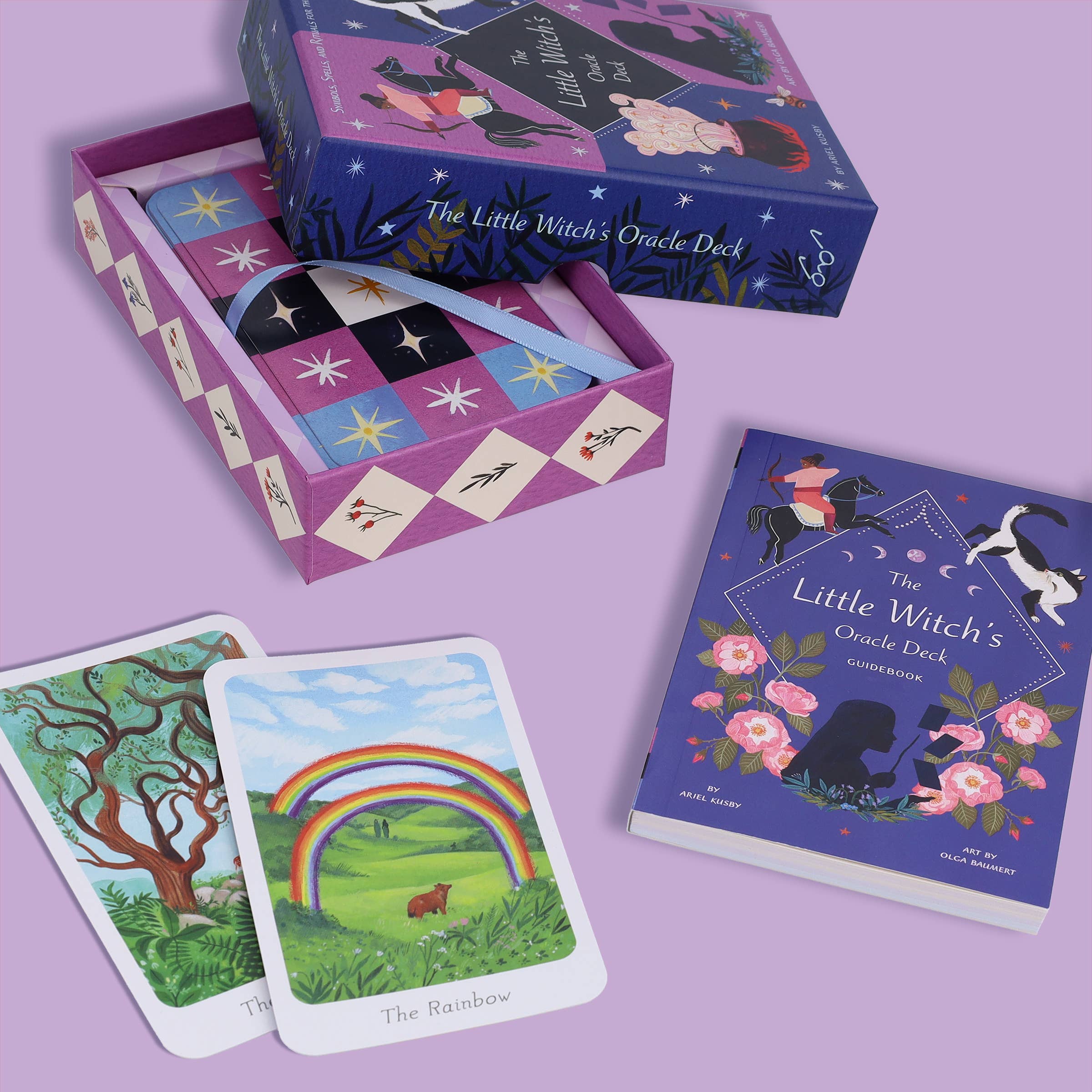 The Little Witch's Oracle Deck with cards and box on a purple background