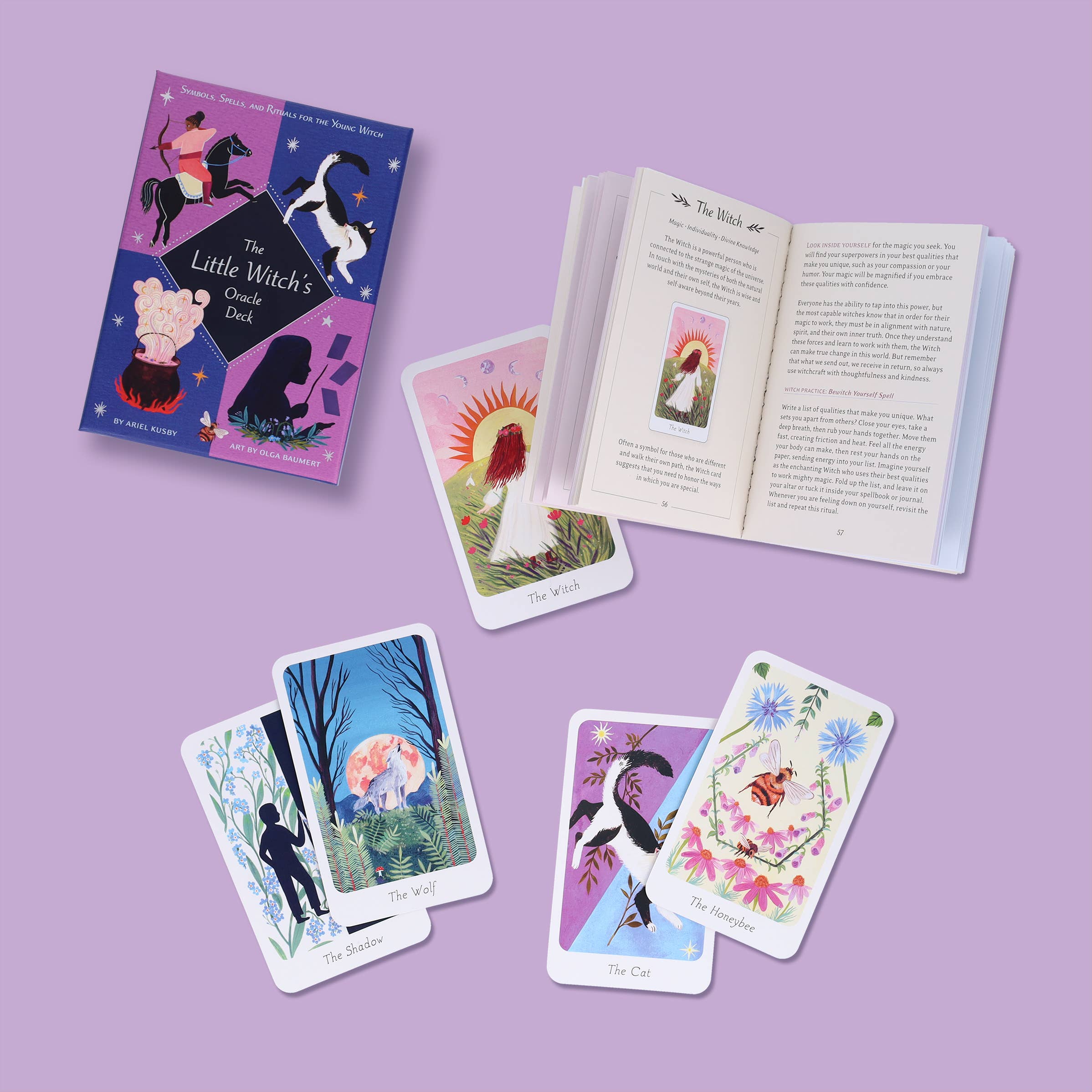 Set of tarot cards and book on a purple background