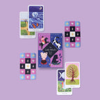 Collection of tarot cards and oracle cards on a purple background