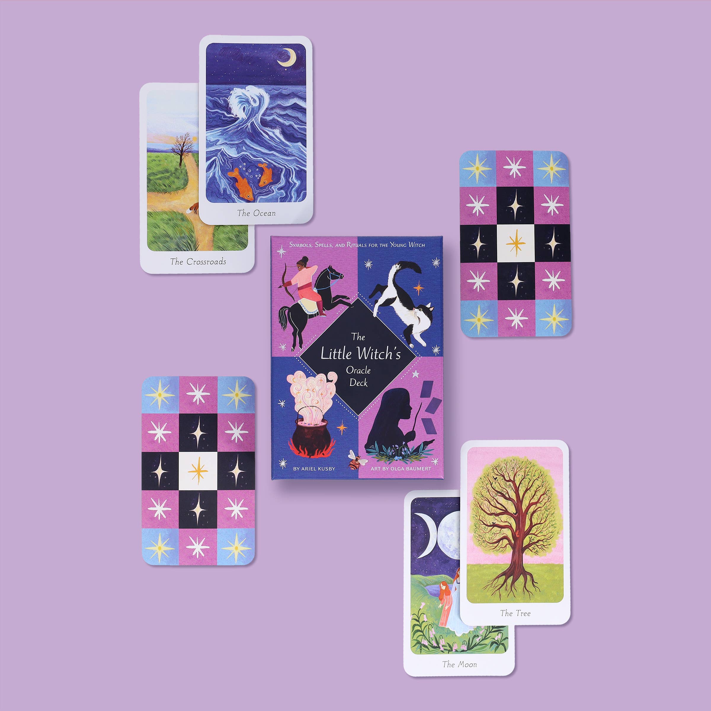 Collection of tarot cards and oracle cards on a purple background