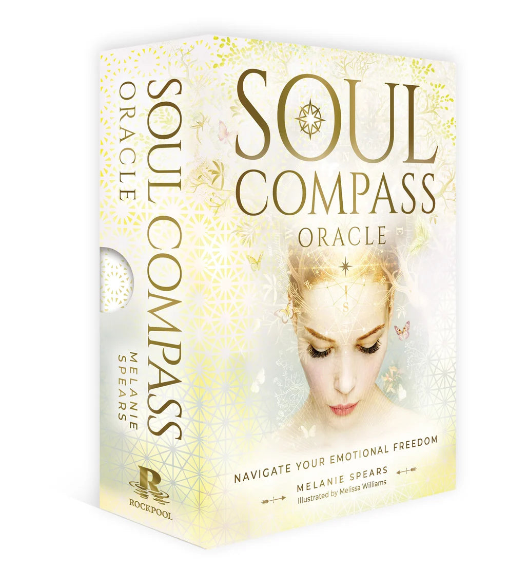 Soul Compass Oracle deck box by Melanie Spears, featuring a soft cream and gold design with a central illustration of a woman's face and gold lettering, shown on a clean white background.