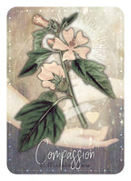 Card with floral design and 'Compassion' text, featuring a soft color palette.