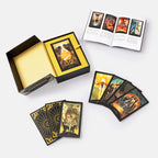 Tarot card set with cards spread out and box on a white background