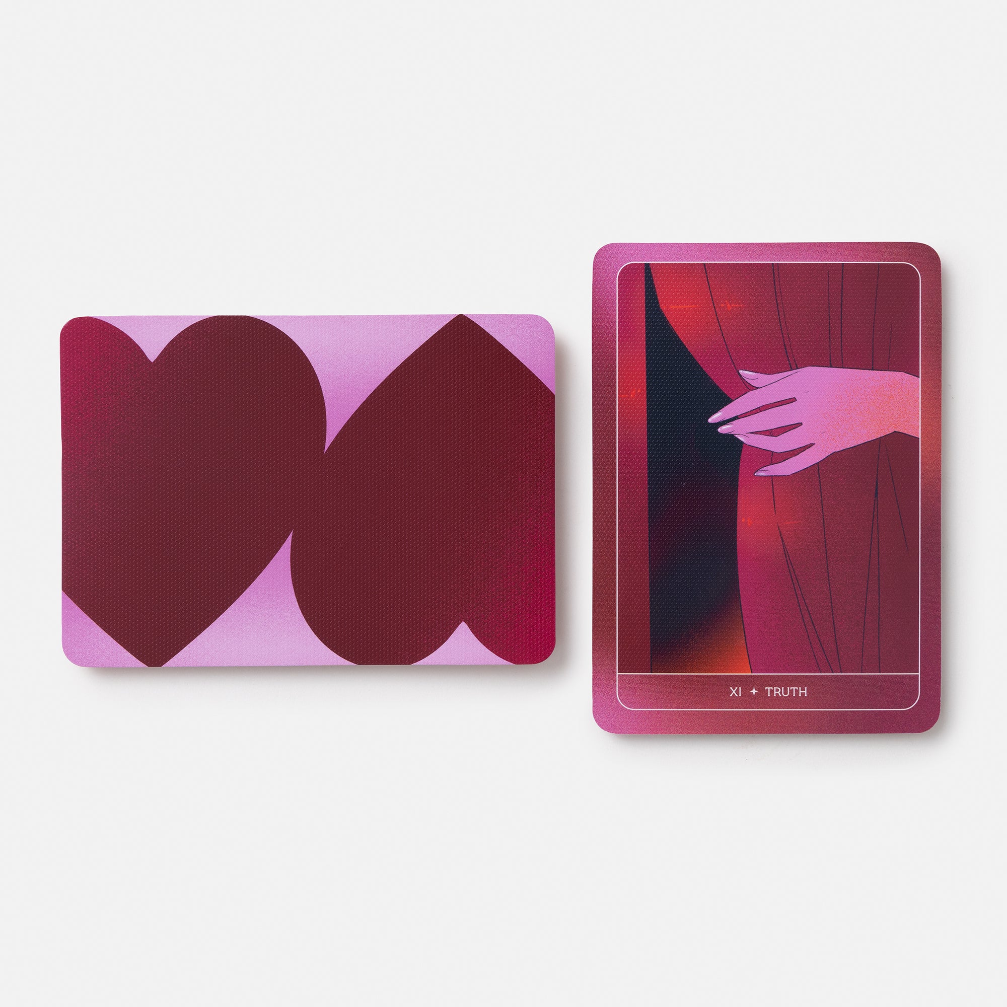 Two pink and red illustrated cards on a light gray background, one showing overlapping heart shapes and the other showing a hand behind red curtains with the text 'X + TRUTH' at the bottom.