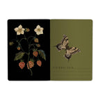 Two card designs featuring botanical illustrations on a black and green background.