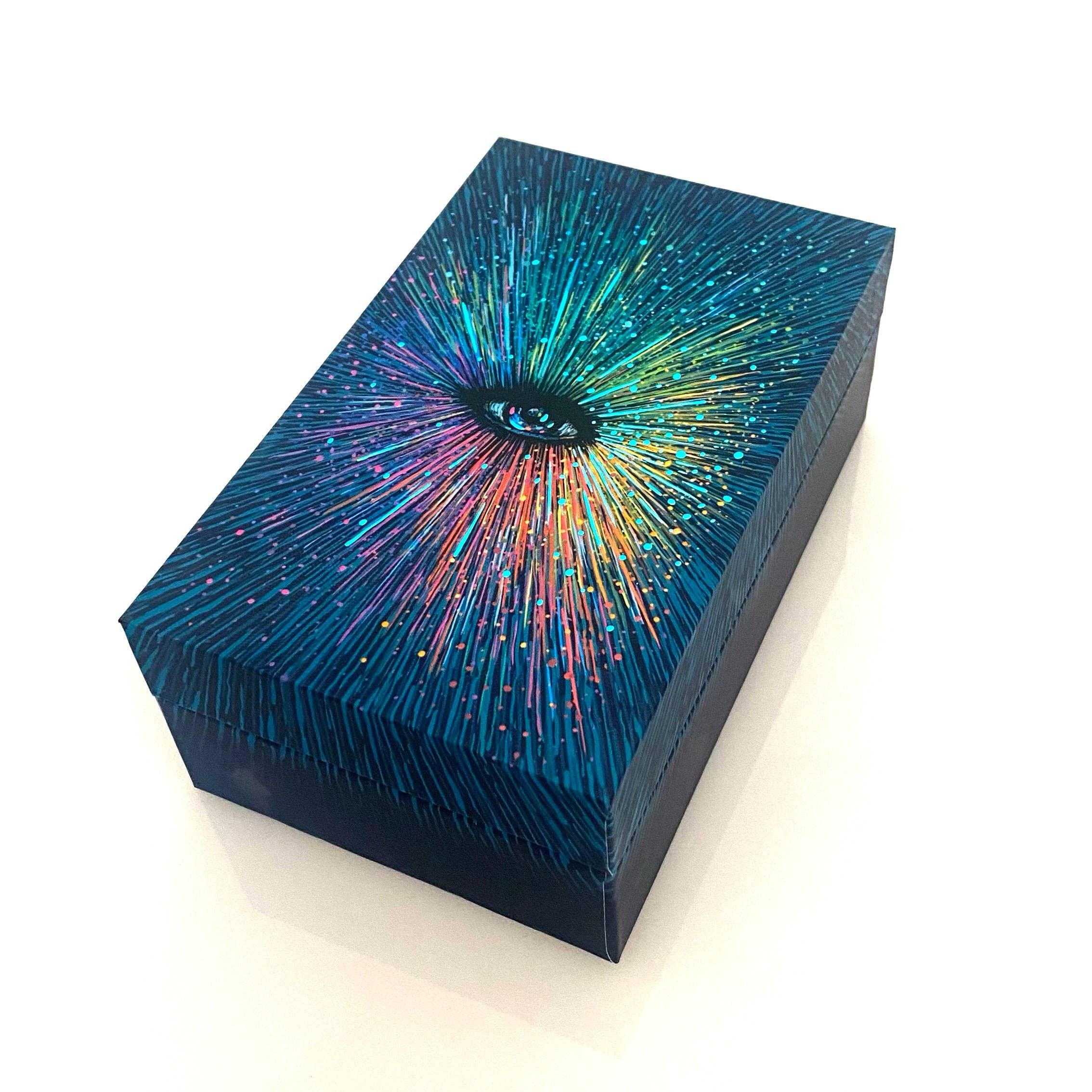 Decorative box with a colorful starburst design on a white background