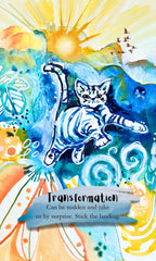 Watercolor art print featuring a blue and white cat leaping through a vibrant landscape with a bright yellow sun, birds, and abstract swirls. Text at the bottom reads, 'Transformation Can be sudden and take us by surprise.