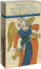 Cardboard box with vintage illustration of an angel and text 'Tarocchichi Marsigliesi Fratelli Recchi' on a beige background.
