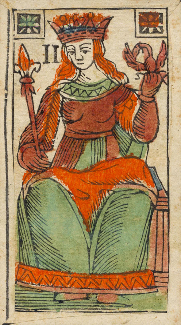 Card featuring a figure in a red and green outfit with a crown, holding a scepter and orb.