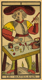 Vintage tarot card featuring a figure labeled 'Le Bateleur' with a table and tools.