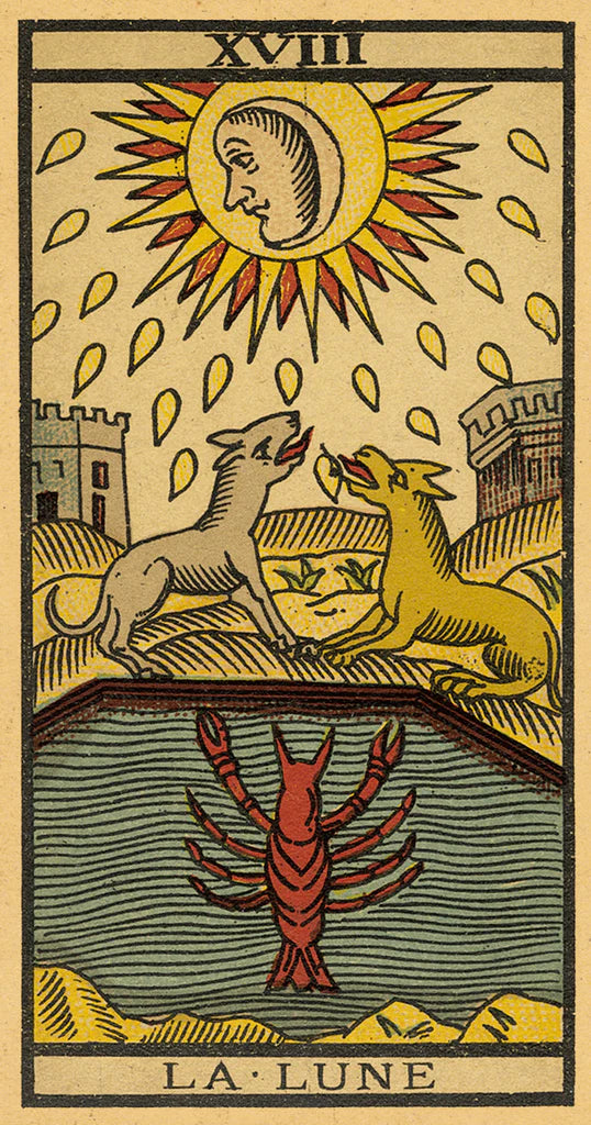 Vintage tarot card featuring two wolves and a lobster with a moon and sun illustration above them.