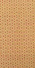 Beige background with small red polka dots