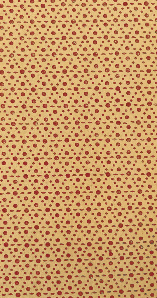 Beige background with small red polka dots