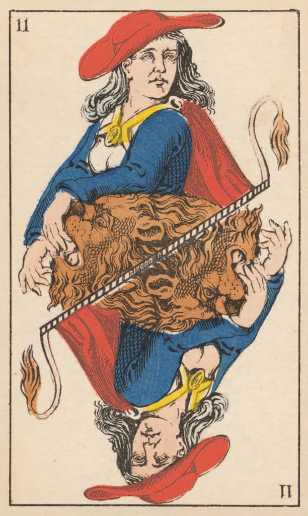 Card from a tarot deck with a person holding a lion, red hat, and blue outfit.