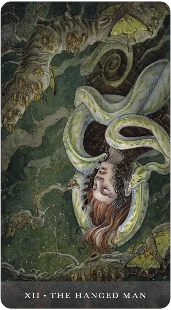 Tarot card titled 'The Hanged Man' with a mystical design featuring a person hanging from a tree.