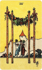 Tarot card with a yellow background, featuring two tall trees, a castle, and a figure holding a blue cloth.