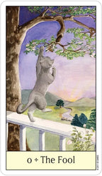 Card titled 'The Fool' featuring a cat on a fence with a scenic background