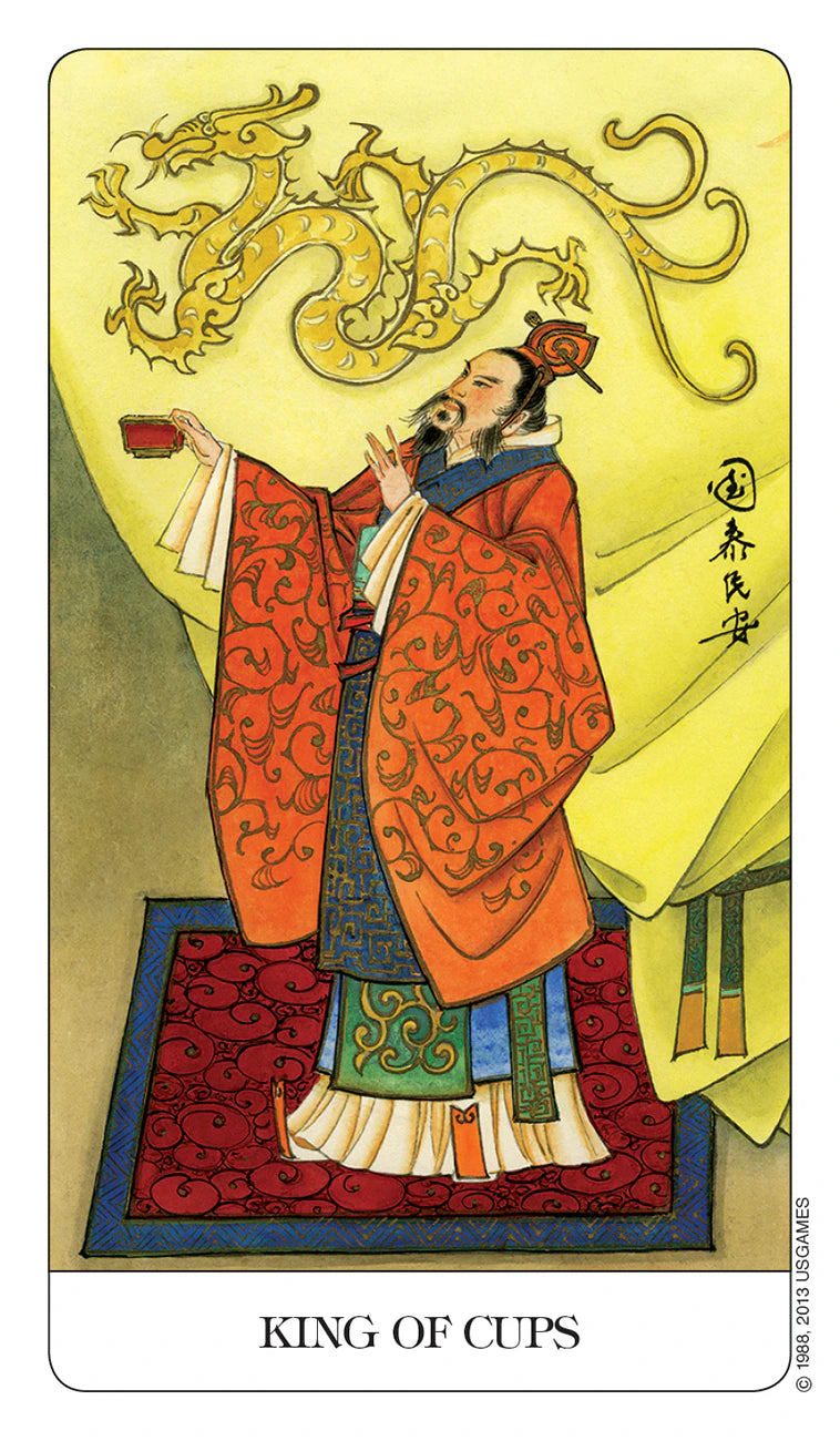 Card featuring a person in traditional attire with a dragon above, labeled 'King of Cups'.