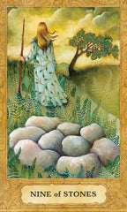 Card from a tarot deck featuring a woman with long hair holding a staff, standing near stones in a natural setting.