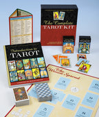 Complete Tarot Kit with books, cards, and spread on a light blue background