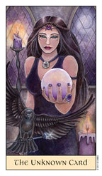 Card featuring a woman with dark hair and purple eyes, holding a crystal ball, with an owl and candles in the background.