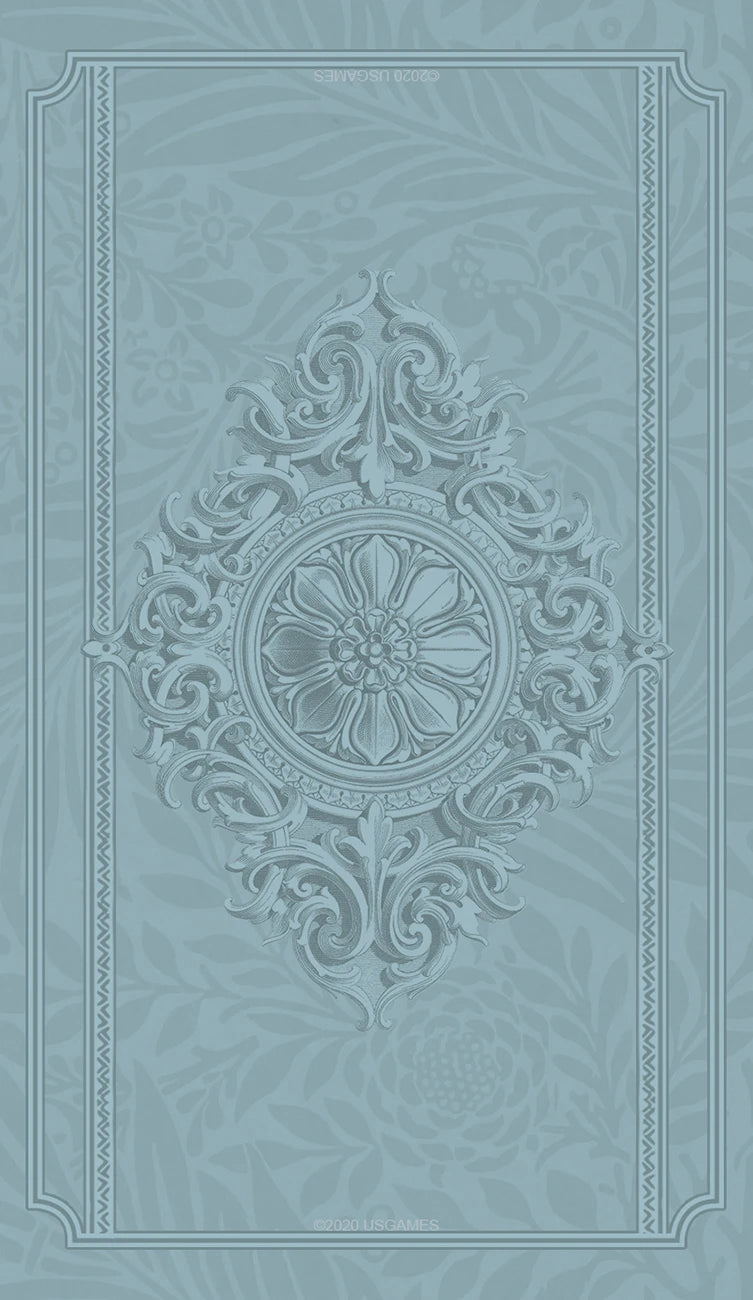 Decorative book cover with intricate patterns on a light blue background