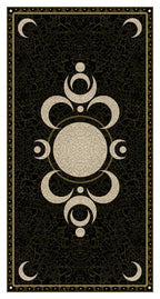 Decorative black and gold card with central circular design and moon symbols on a textured background