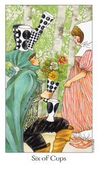 Card from a tarot deck titled 'Six of Cups' featuring two people in a forest setting.
