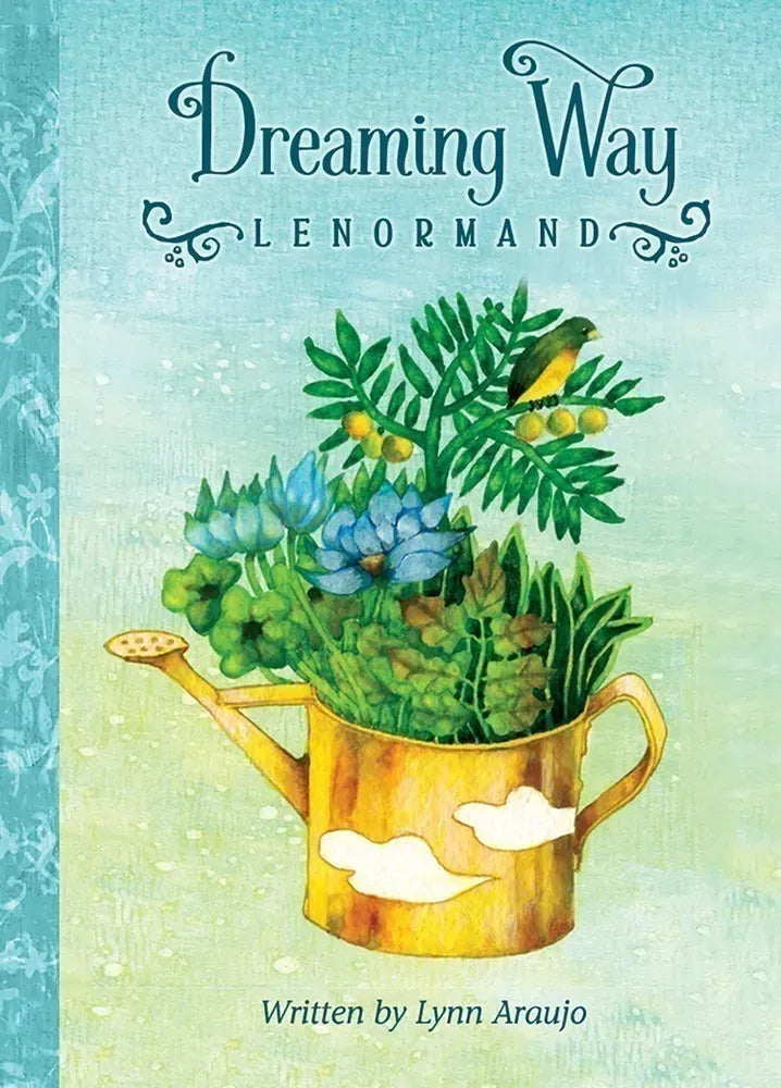 Book cover of 'Dreaming Way Lenormand' with a watering can and plants on a light blue background.