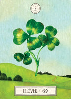 Card with a four-leaf clover illustration on a green landscape background