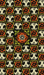 Patterned fabric with red, black, and white floral design on a green background
