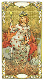 Art Nouveau-style tarot card with a woman holding a candle, surrounded by intricate designs.