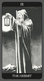 Tarot card featuring 'The Hermit' with a robed figure holding a lantern against a mountainous background.