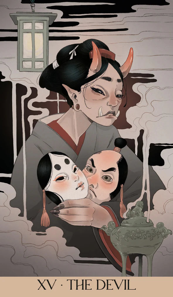 Card XV - The Devil from the Yokai Tarot. A woman with horns holds two masks in her left hand.