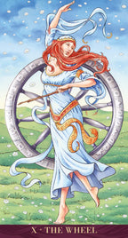 Tarot card featuring a woman with red hair and a snake, standing next to a wheel on a grassy background.