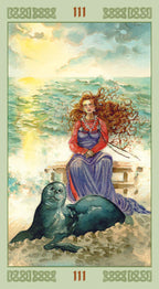 Tarot card with a woman and seal by the sea
