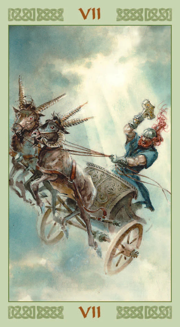 Tarot card with a chariot pulled by goats and a person in a blue outfit against a cloudy sky.