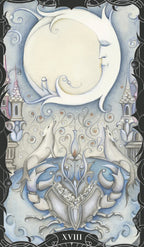 Decorative card with two dolphins, a moon, and intricate designs on a dark background