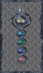 Decorative design with a spiral of colored stones on a textured background