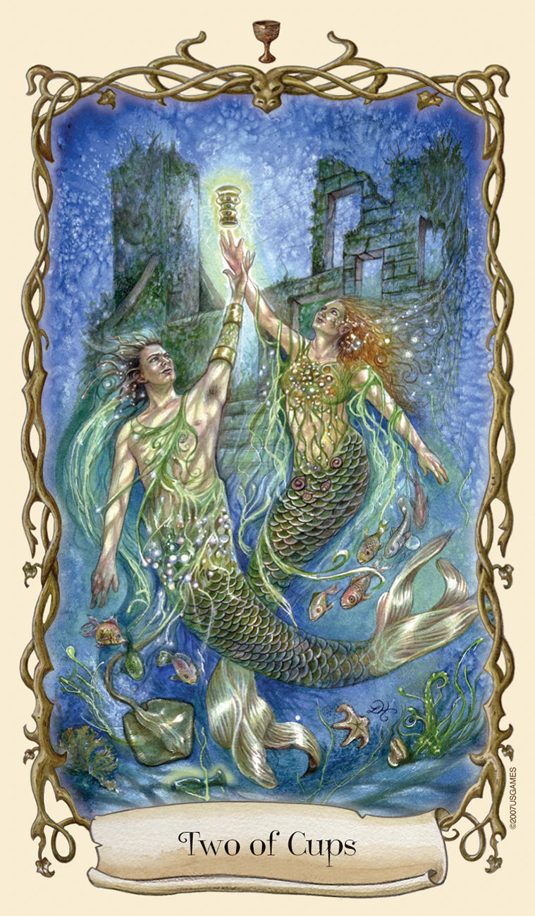 Two mermaids reaching towards each other with a blue background, labeled 'Two of Cups'.