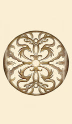 Decorative metal trivet with intricate patterns on a beige background