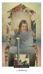 Tarot card featuring a person holding a sword with floral border and text 'King of Swords' at the bottom.