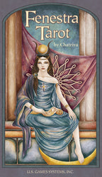 Fenestra Tarot card featuring a woman in a blue dress with wings, sitting on a bench.