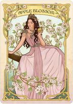 Art Nouveau-style illustration of a woman holding an apple amidst floral branches, with 'Apple Blossom' text at the top.